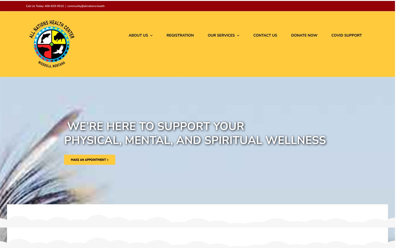 The old All Nations Health Center homepage: a bright yellow header with the center's logo and plain navigation, above a washed-out light-blue hero where the headline We're here to support your physical, mental, and spiritual wellness sits over a faded feather photo with a single Make an appointment button.